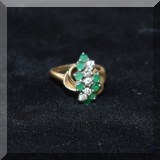 J02. Gold and gemstone ring. 